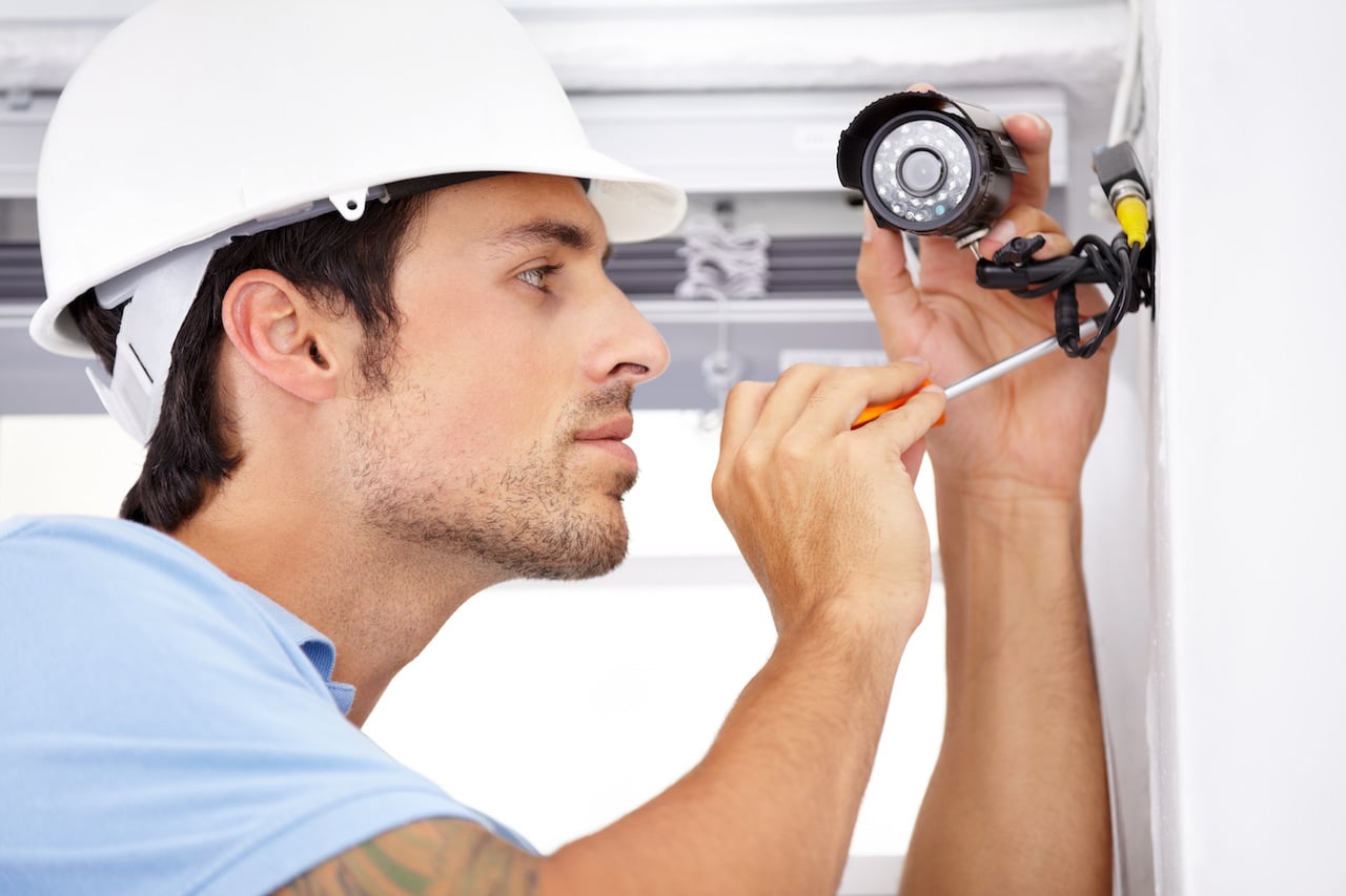 employee installing video surveillance systems